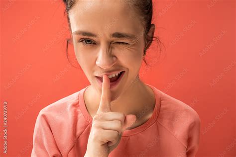 Secret, gossip concept. Young woman whispering a secret behind her hand ...