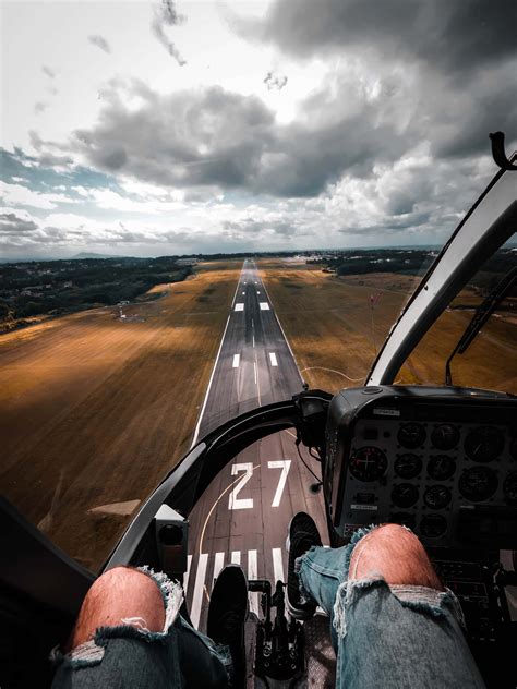Download Pilot Landing On A Runway POV Wallpaper | Wallpapers.com
