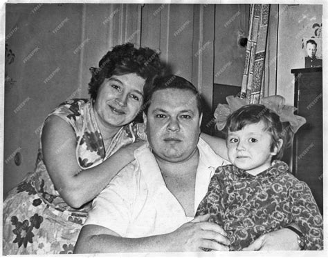 Premium Photo | Vintage portrait of a happy family Mom dad and daughter