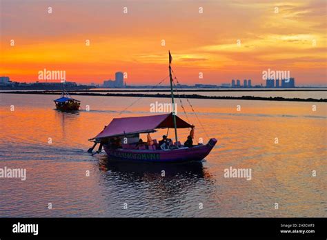 Sunset Pantai Ancol Beach, Jakarta, Indonesia Stock Photo - Alamy