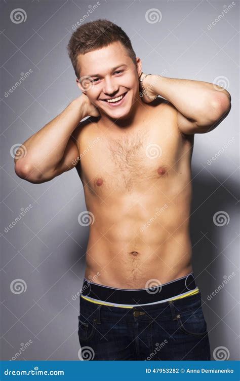 shirtless handsome man  fit body lean   wall stock photo
