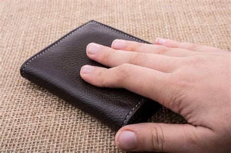 premium photo wallet  hand saving  finance concept