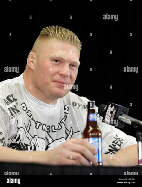Brock Lesnar with a Bud Light bottle at a post-fight press conference ...