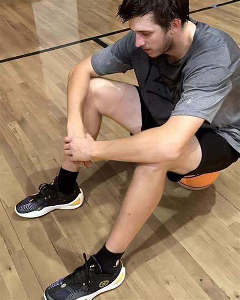 Download Basketball Player Restingon Court.jpg Wallpaper | Wallpapers.com