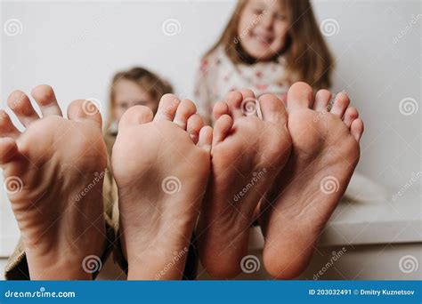 boys feet  bed close  boy lying  bed  reading  book royalty