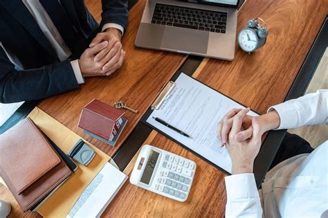 premium photo high angle view  agent  client  table