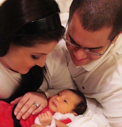 Dominique Moceanu and Mike Canales with new Baby Carmen Noel Canales