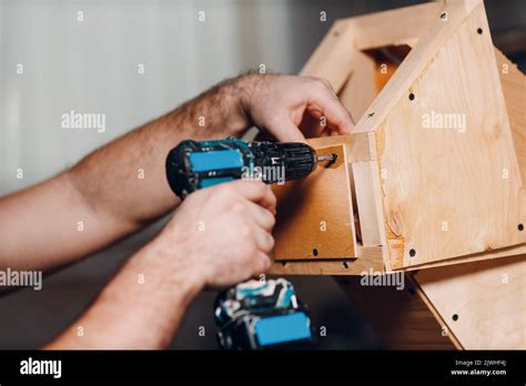 Artisan craftsman carpenter sculptor frame wooden create carcass framework. Wooden board ...