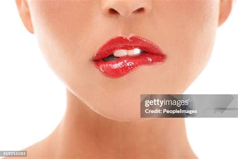 bitten lip stock  high res pictures  images getty images