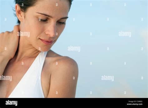 woman holding neck   portrait stock photo alamy