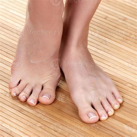 Beautiful female feet on a wooden floor, closeup shot 15743031 Stock ...