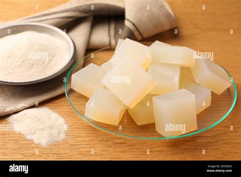 jelly cubes  powder  wooden table closeup stock photo