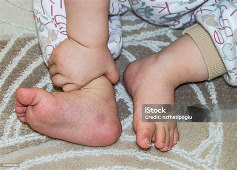 Tiny Baby Feet Keep The Tiny Babys Feet Stock Photo - Download Image