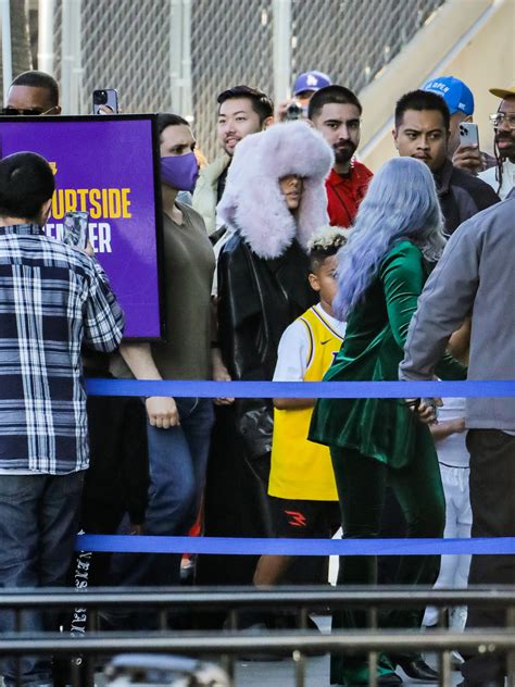 Kanye West's Wife Bianca Censori Goes Nude Under Clear Coat | In Touch