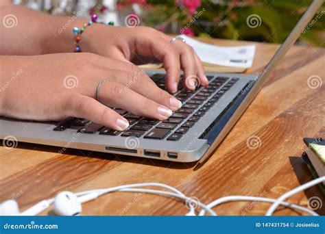 Typing on a Laptop Keyboard Stock Photo - Image of earphones, hand ...