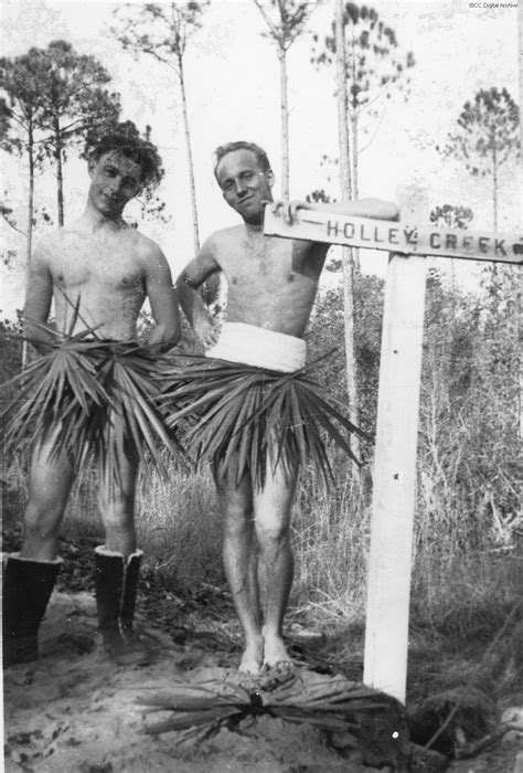 Two men in grass skirts · IBCC Digital Archive