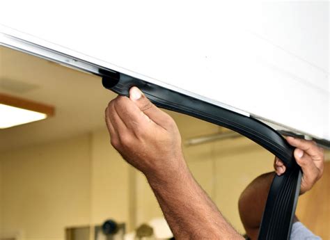 how to put weather stripping on garage door