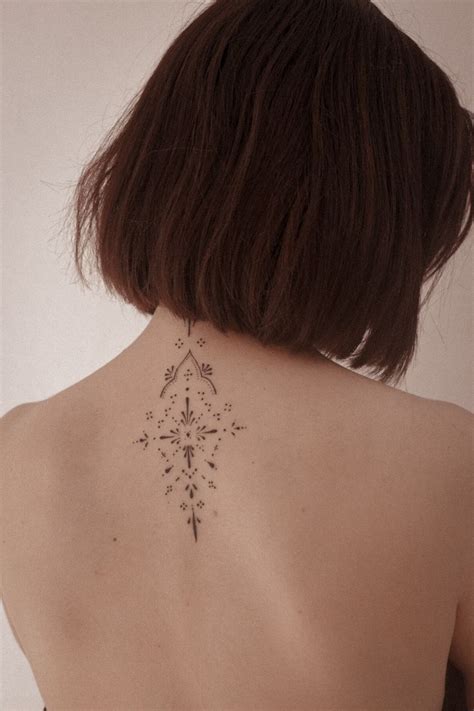 Ornamental tattoo feminine back tattoo | Feminine back tattoos, Back ...