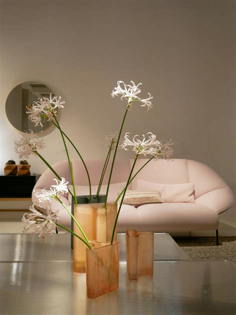 white flower  glass vase  glass table  stock photo