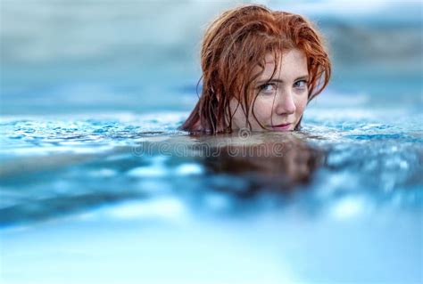 Overhead Shot of a Redhair Bikini Woman Redhead Laying in the Sunshine