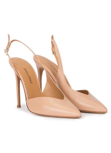Nude leather asymmetric heeled slingback pumps . PURA LOPEZ