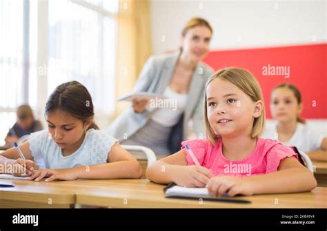 Pupils in classroom Stock Photo - Alamy