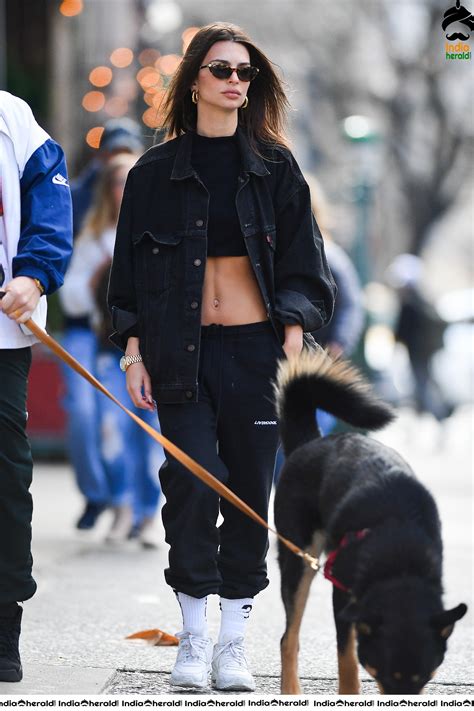 Emily Ratajkowski flaunts her sexy abs while talking a walk