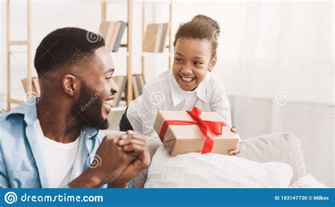 Adorable Black Girl Giving Handmage Girl To Father Stock Photo - Image