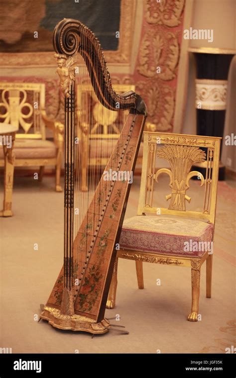 Golden Harp music in luxury interior Stock Photo - Alamy