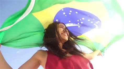 Cheerful girl from brazil with brazilian flag — Stock Video © Wundervisuals #45453159