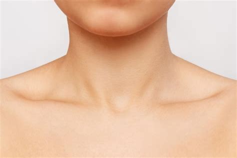 premium photo cropped shot   young womans collarbone isolated