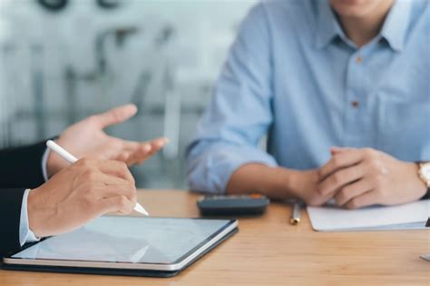 premium photo business consultant meeting  discussing  investment