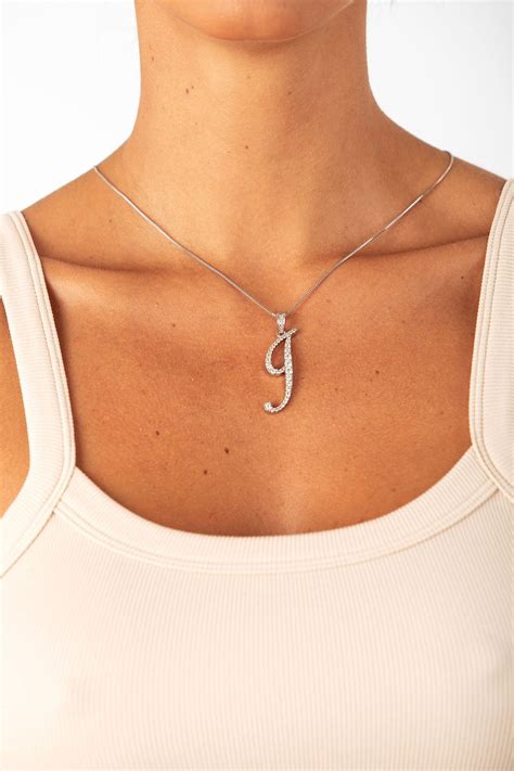 Simone Biles Wears a Red Corset and Bottega Veneta Bag | PS Fashion