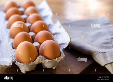 dozen brown eggs stock photo alamy