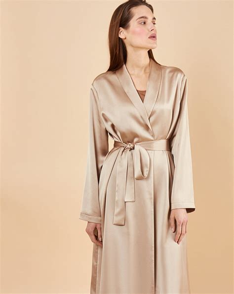 In super soft and silky beige, featuring a tie waist and full length ...