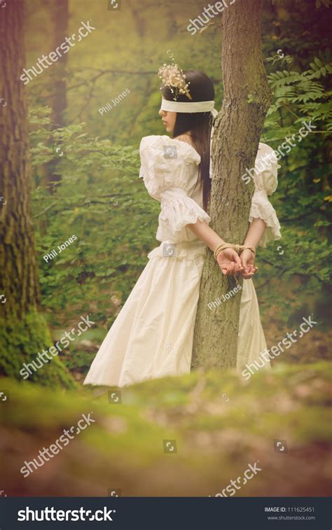 dark fairytale inspired image beautiful young woman  woods tied