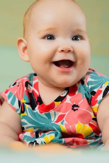 premium photo portrait   cute baby girl  blue eyes  colorful