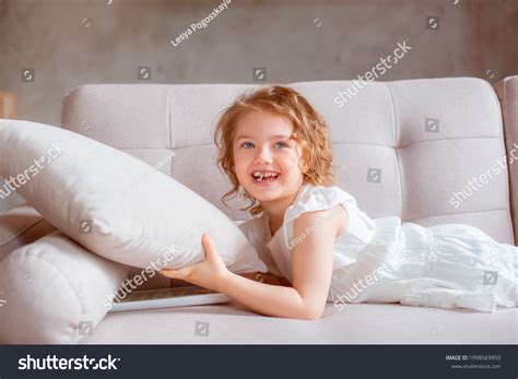 Little Girl Lying On Couch Stock Photo 1998569993 | Shutterstock