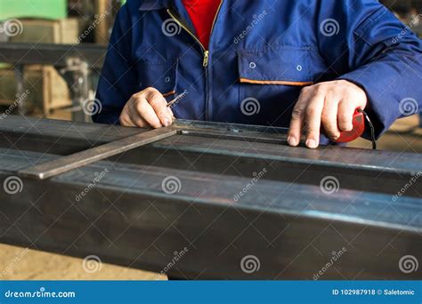 worker measuring fresh welded steel bar stock photo image  manly
