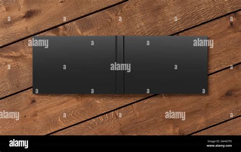 Blank black horizontal open and upside down book cover on wooden boards isolated with clipping ...