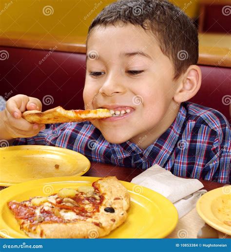 Boy eating a pizza stock photo. Image of dining, child - 10853384