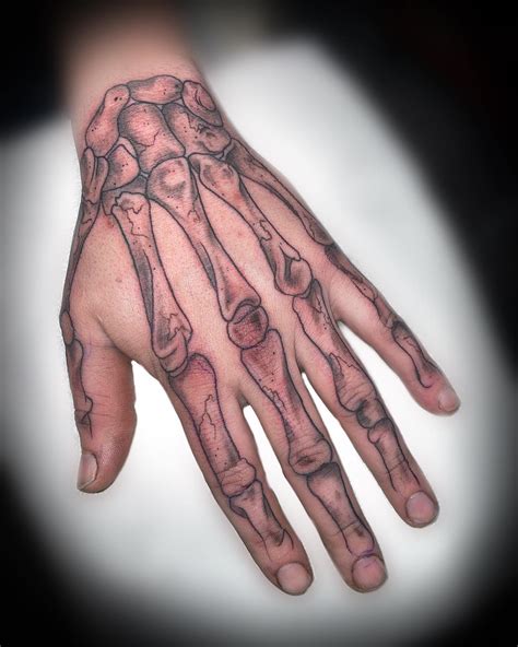 61 Skeleton Hand Tattoo Ideas With Deep Meanings