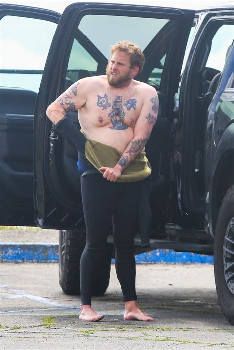 Jonah Hill wipes out before taking shirtless selfies on surfing trip in