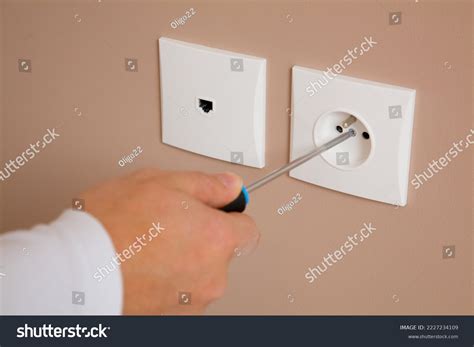electrician installing socket wall stock photo  shutterstock