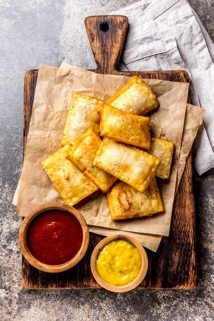 Premium Photo | Fried cheese empanadas with sauces