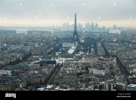 Winter view of the Eiffel tower over Paris, with La Defense skyline behind Stock Photo - Alamy