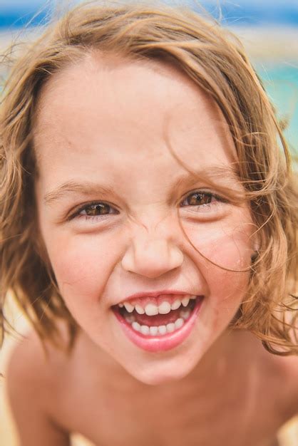 Premium Photo | Close-up portrait of shirtless cheerful girl standing