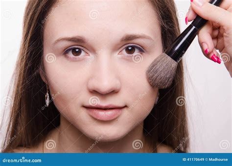 makeup artist applies powder  cheeks model stock image image