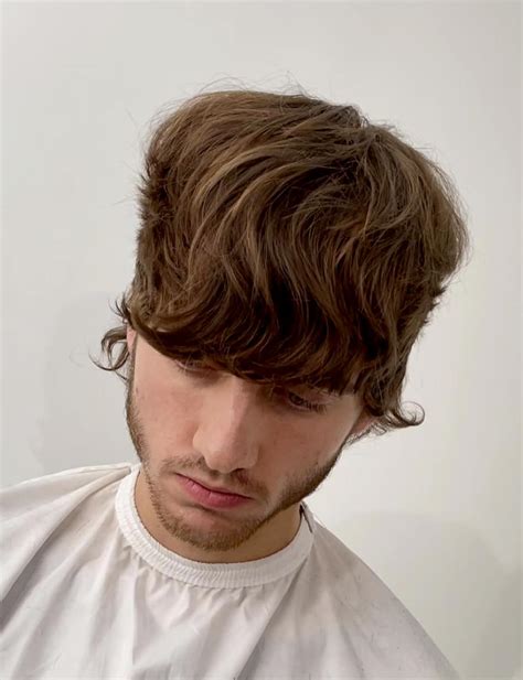 Stylists explain how to style a wolf cut for men with straight hair 9