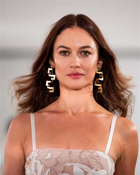 Download Caption: Olga Kurylenko - Glamorous and Timeless Beauty